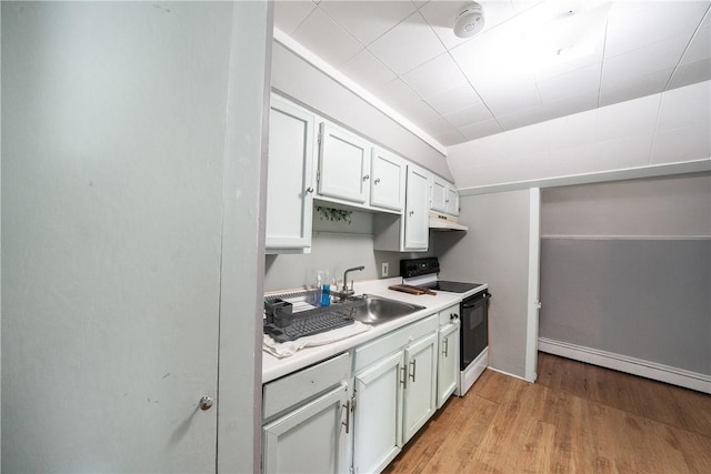1 Spring St, Hopkinton, RI 02832 - kitchen with range with electric cooktop, light wood-type flooring, white cabinetry, light countertops, and a sink