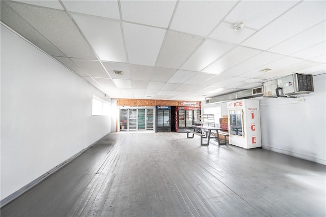 1 Spring St, Hopkinton, RI 02832 - exercise room with a paneled ceiling, hardwood / wood-style flooring, and baseboards