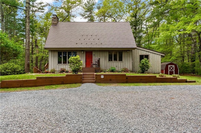 310 Old Coach Rd, Charlestown, RI 02813 - view of front of house featuring a chimney and board and batten siding