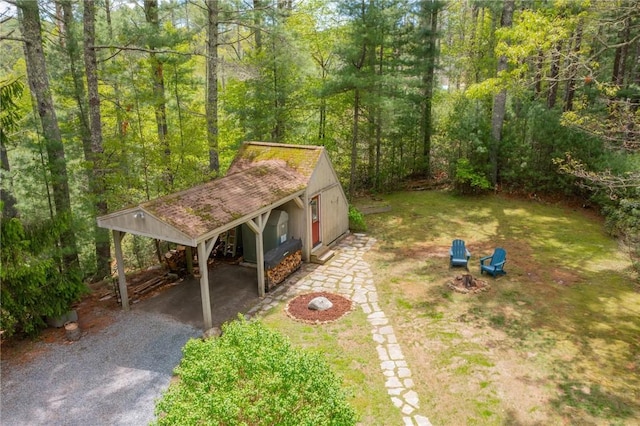 310 Old Coach Rd, Charlestown, RI 02813 - view of yard featuring gravel driveway and a forest view
