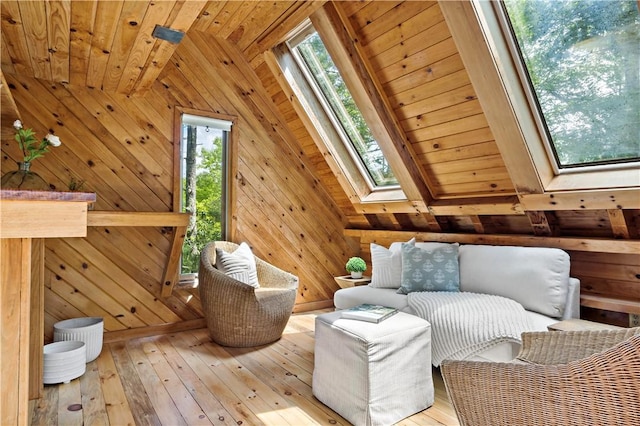 310 Old Coach Rd, Charlestown, RI 02813 - sitting room with a skylight, wooden ceiling with exposed beams, wooden walls, and wood-type flooring