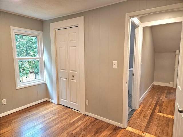 29 Arthur St, Warwick, RI 02888 - unfurnished bedroom featuring hardwood / wood-style flooring, baseboards, and a closet