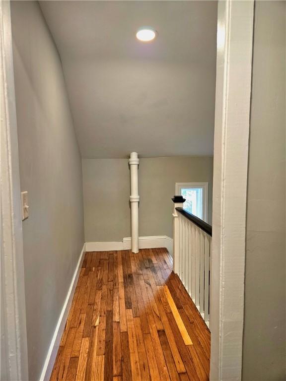 29 Arthur St, Warwick, RI 02888 - hall featuring dark wood-style floors, lofted ceiling, an upstairs landing, baseboards, and recessed lighting