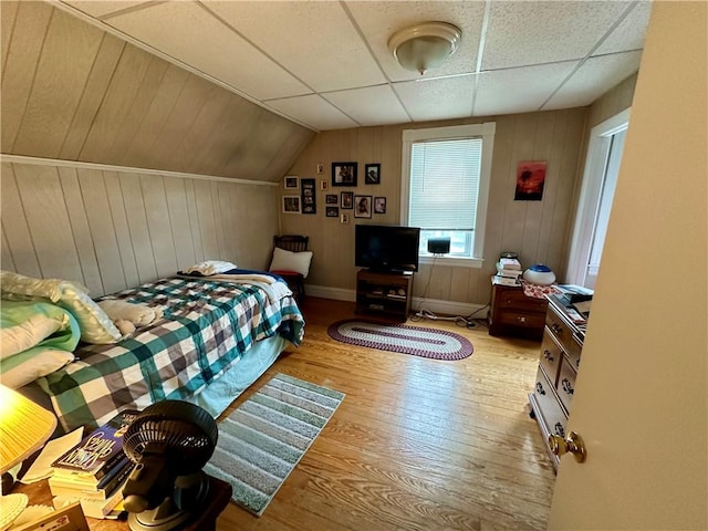 3 Jefferson St, Warwick, RI 02888 - bedroom with hardwood / wood-style flooring, baseboards, wooden walls, and vaulted ceiling