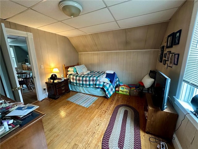 3 Jefferson St, Warwick, RI 02888 - bedroom featuring wood finished floors, vaulted ceiling, and wood walls