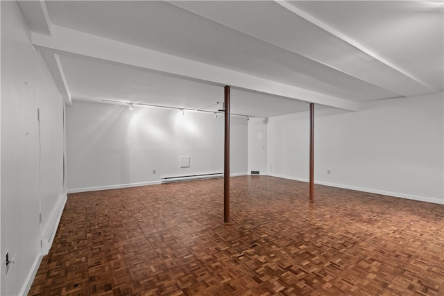 446 Paddock Ln, Bristol, RI 02809 - finished basement with a baseboard heating unit, baseboards, and track lighting