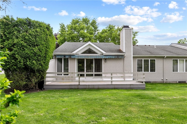 446 Paddock Ln, Bristol, RI 02809 - rear view of house with roof with shingles, a yard, a deck, and a chimney