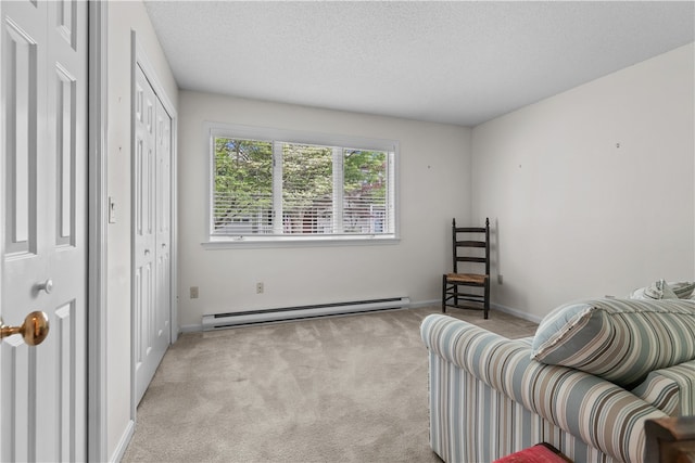 446 Paddock Ln, Bristol, RI 02809 - sitting room featuring baseboard heating, light colored carpet, a textured ceiling, and baseboards