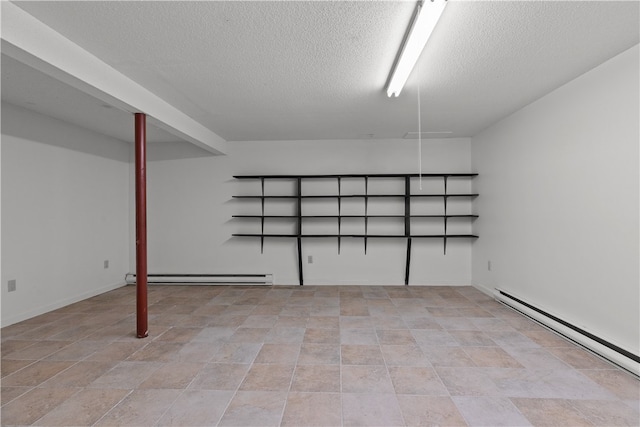 446 Paddock Ln, Bristol, RI 02809 - finished basement with a baseboard heating unit, a baseboard radiator, and a textured ceiling