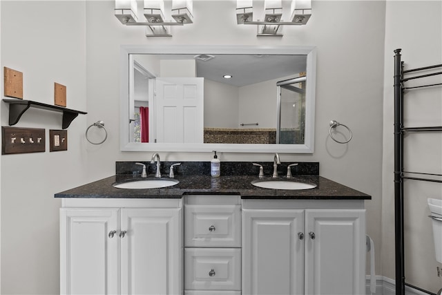 446 Paddock Ln, Bristol, RI 02809 - bathroom with double vanity and toilet