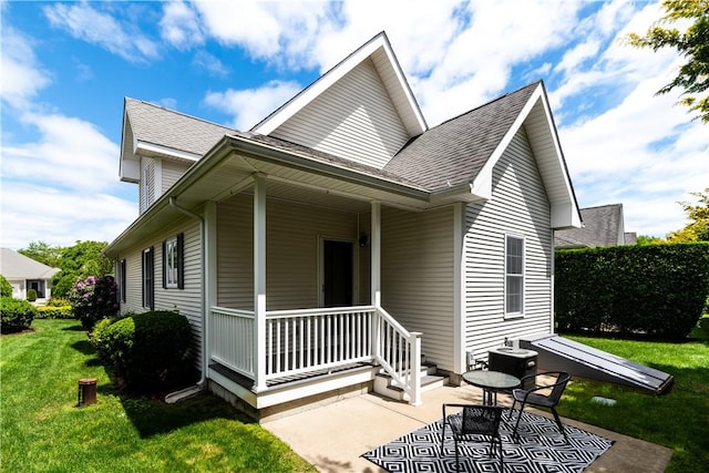10 Kristin Ct, Coventry, RI 02816 - view of front of home with a front lawn, central AC, and a shingled roof