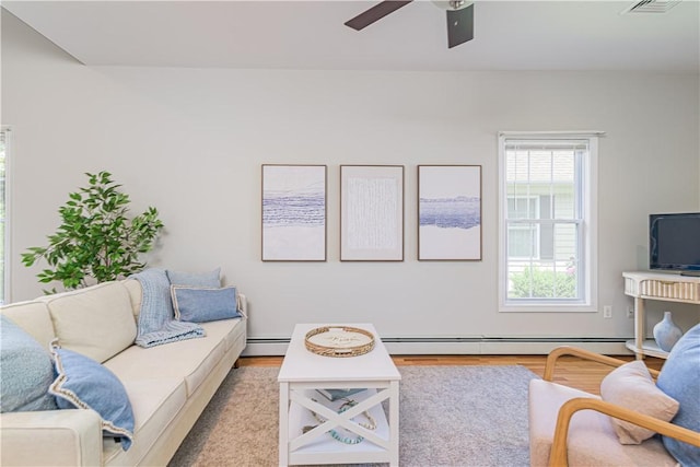 10 Kristin Ct, Coventry, RI 02816 - living room with baseboard heating, wood finished floors, and a ceiling fan