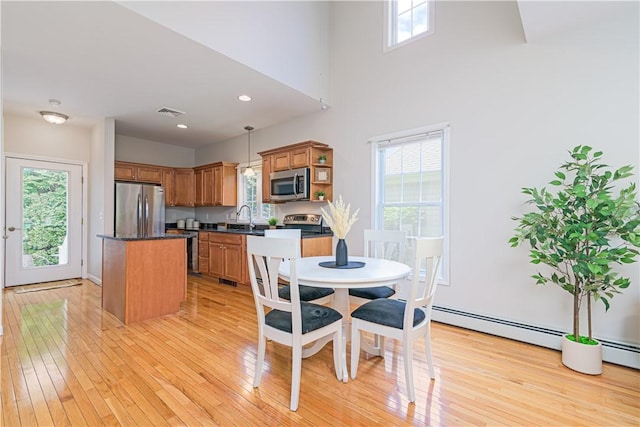 10 Kristin Ct, Coventry, RI 02816 - dining space with light wood-style floors