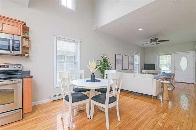10 Kristin Ct, Coventry, RI 02816 - dining room featuring light wood finished floors, baseboard heating, a ceiling fan, baseboards, and recessed lighting