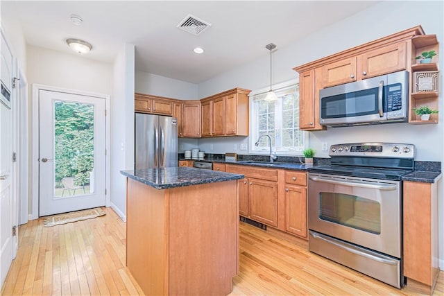 10 Kristin Ct, Coventry, RI 02816 - kitchen with appliances with stainless steel finishes, a sink, a center island, light wood-type flooring, and recessed lighting