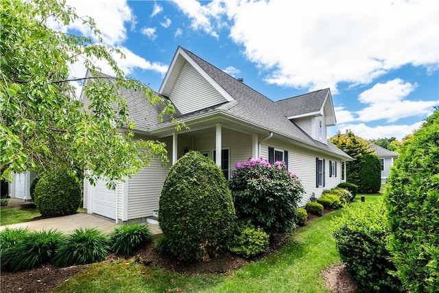 10 Kristin Ct, Coventry, RI 02816 - view of property exterior featuring concrete driveway and a shingled roof