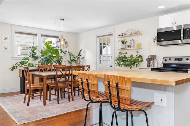 405 Eaton St, Providence, RI 02908 - dining area with dark wood finished floors and baseboards