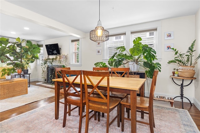 405 Eaton St, Providence, RI 02908 - dining area featuring wood finished floors, baseboards, a fireplace with raised hearth, and recessed lighting