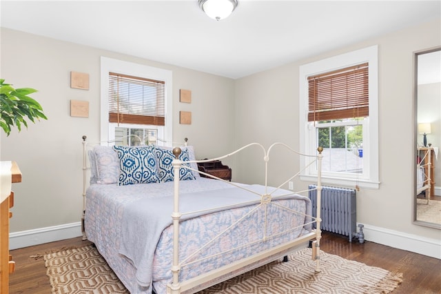 405 Eaton St, Providence, RI 02908 - bedroom featuring radiator heating unit, wood finished floors, and baseboards