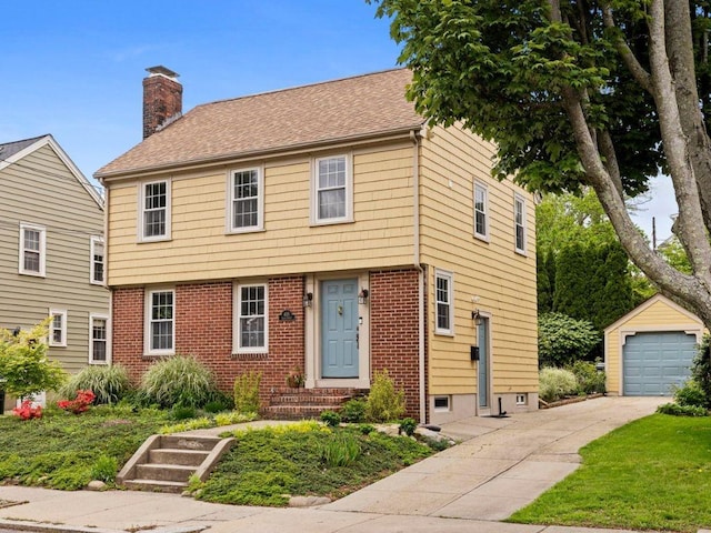 405 Eaton St, Providence, RI 02908 - colonial inspired home with a chimney, an outdoor structure, concrete driveway, and brick siding