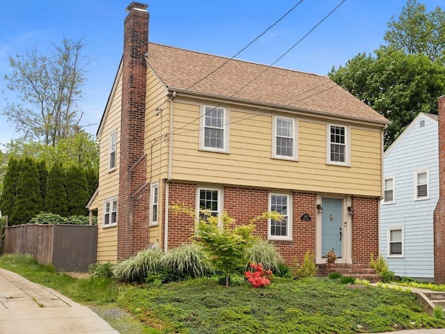405 Eaton St, Providence, RI 02908 - colonial home with a chimney, a shingled roof, and brick siding