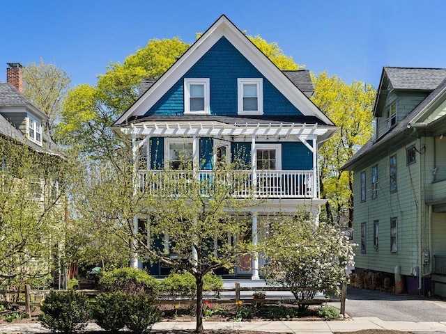 143 Ivy St, Providence, RI 02906 - view of front facade featuring a porch and a balcony