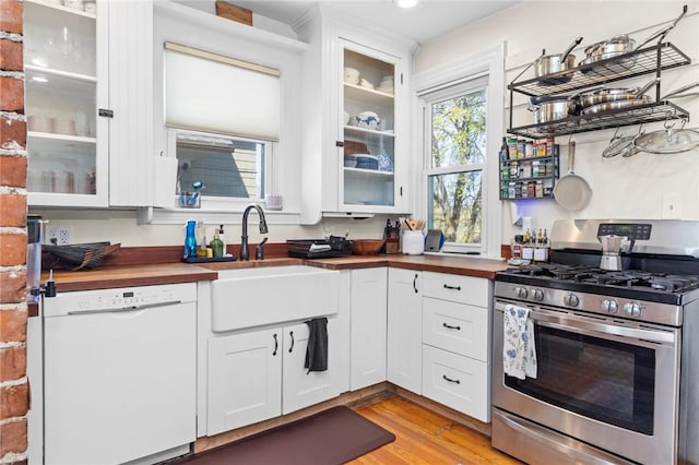 143 Ivy St, Providence, RI 02906 - kitchen featuring stainless steel gas range oven, butcher block countertops, dishwasher, and a sink