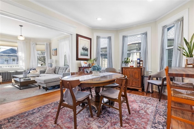 143 Ivy St, Providence, RI 02906 - dining room with radiator, healthy amount of natural light, wood finished floors, crown molding, and recessed lighting