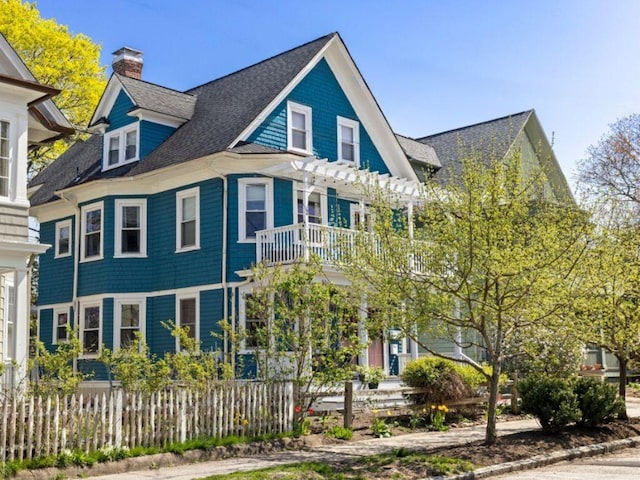 143 Ivy St, Providence, RI 02906 - view of front of house with a balcony and a chimney