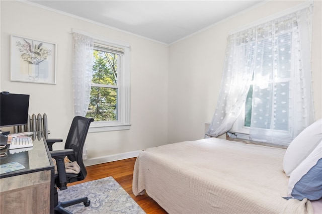 143 Ivy St, Providence, RI 02906 - bedroom with wood finished floors, crown molding, baseboards, and a desk