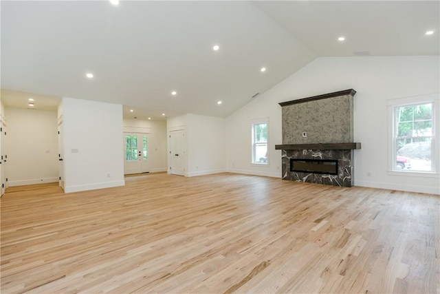 68 Orchard Ave, Johnston, RI 02919 - unfurnished living room with healthy amount of natural light, light wood-style floors, a large fireplace, recessed lighting, and high vaulted ceiling