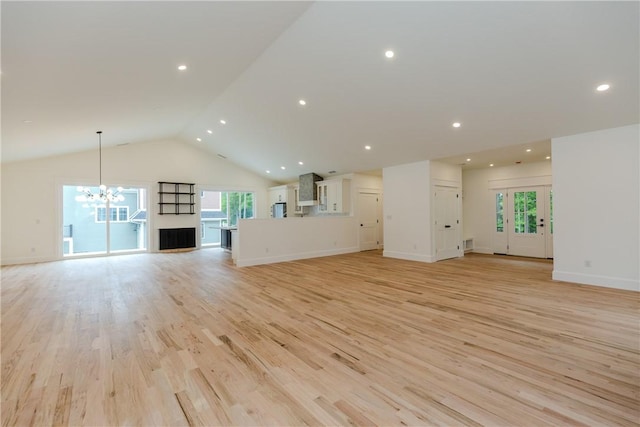 68 Orchard Ave, Johnston, RI 02919 - unfurnished living room with light wood-style flooring, a chandelier, baseboards, recessed lighting, and high vaulted ceiling