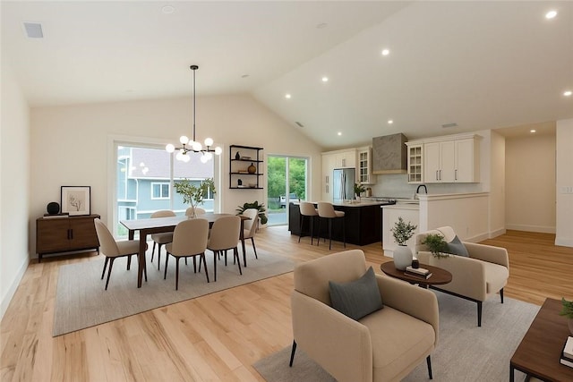 68 Orchard Ave, Johnston, RI 02919 - dining space with light wood-style floors, a chandelier, baseboards, high vaulted ceiling, and recessed lighting
