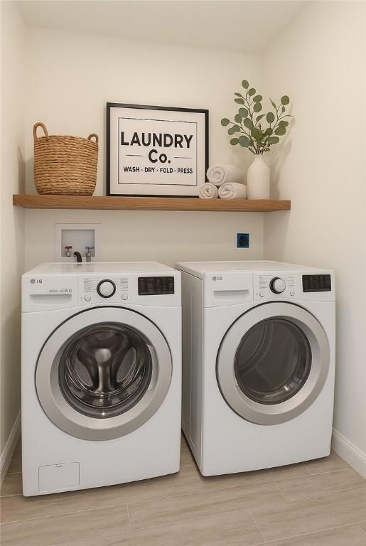 68 Orchard Ave, Johnston, RI 02919 - laundry room with separate washer and dryer and baseboards