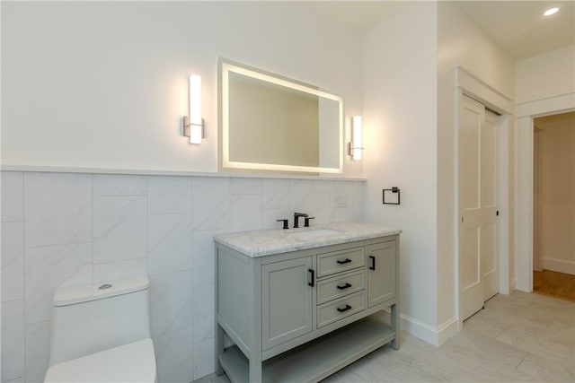 68 Orchard Ave, Johnston, RI 02919 - bathroom with vanity, toilet, and tasteful backsplash