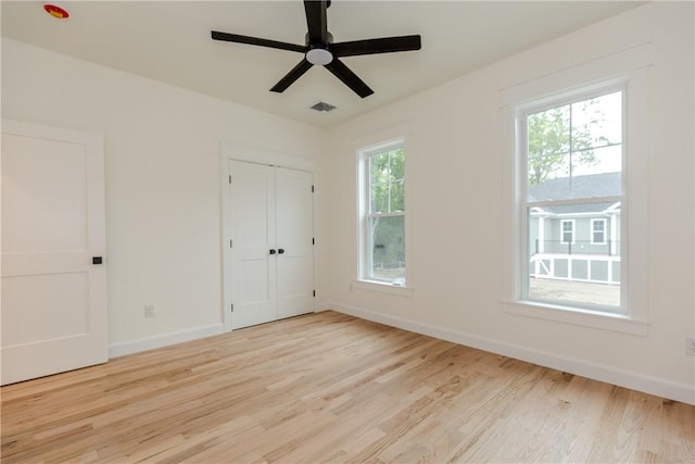 68 Orchard Ave, Johnston, RI 02919 - unfurnished bedroom with wood finished floors, baseboards, a closet, and ceiling fan