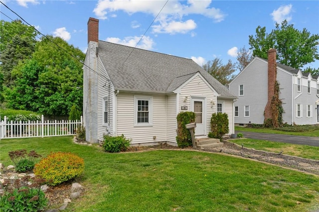 95 George Arden Ave, Warwick, RI 02886 - view of front of house featuring a chimney and roof with shingles