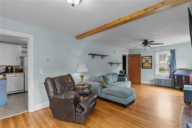 95 George Arden Ave, Warwick, RI 02886 - living room with radiator heating unit, light wood-type flooring, a ceiling fan, baseboards, and beamed ceiling