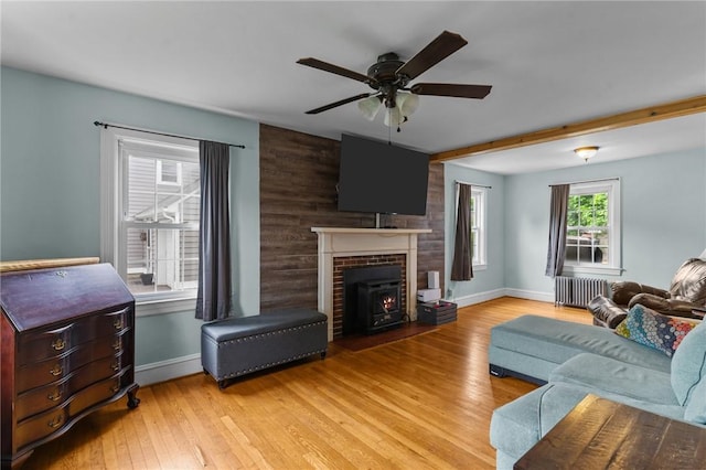 95 George Arden Ave, Warwick, RI 02886 - living area featuring radiator heating unit, ceiling fan, wood finished floors, and baseboards