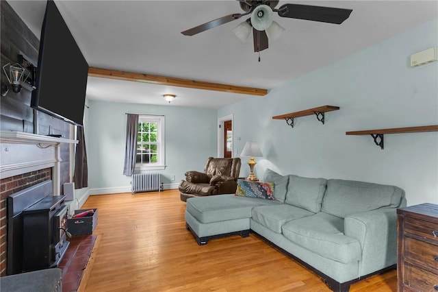 95 George Arden Ave, Warwick, RI 02886 - living area featuring radiator, ceiling fan, light wood-type flooring, beamed ceiling, and baseboards