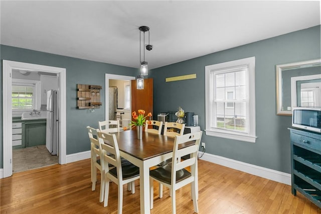 95 George Arden Ave, Warwick, RI 02886 - dining space featuring light wood finished floors and baseboards