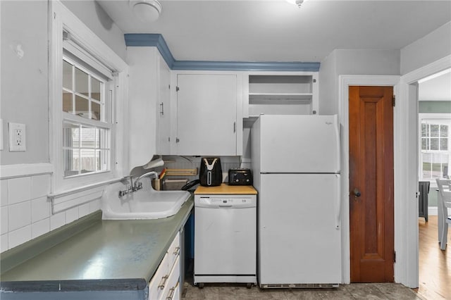 95 George Arden Ave, Warwick, RI 02886 - kitchen featuring white appliances, stainless steel countertops, a sink, and plenty of natural light