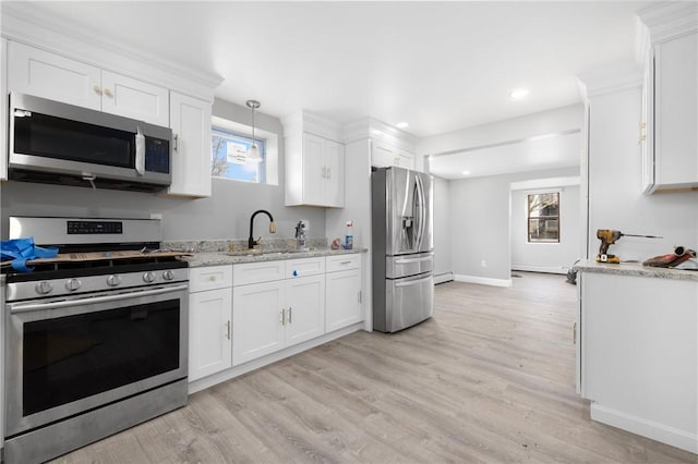 103 Pleasent St, Woonsocket, RI 02895 - kitchen with stainless steel appliances, a sink, white cabinets, light wood-style flooring, and recessed lighting