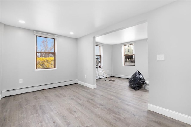 103 Pleasent St, Woonsocket, RI 02895 - unfurnished room featuring baseboard heating, healthy amount of natural light, baseboards, wood finished floors, and recessed lighting