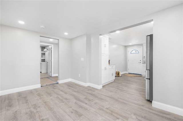 103 Pleasent St, Woonsocket, RI 02895 - unfurnished room with light wood finished floors, baseboards, recessed lighting, and a smoke detector