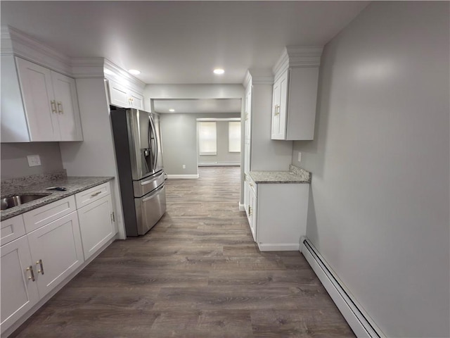 103 Pleasent St, Woonsocket, RI 02895 - kitchen with stainless steel refrigerator with ice dispenser, white cabinets, dark wood-type flooring, and recessed lighting