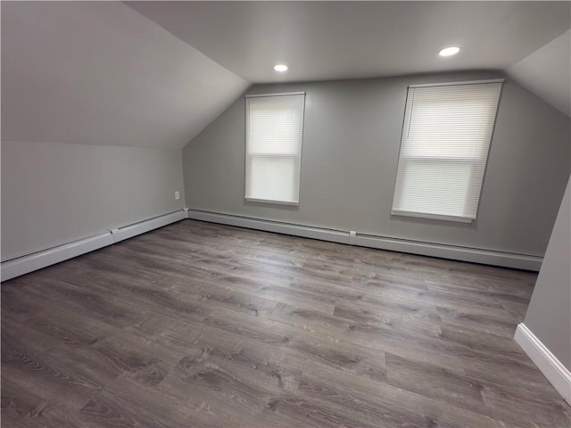 103 Pleasent St, Woonsocket, RI 02895 - additional living space featuring vaulted ceiling, baseboard heating, wood finished floors, baseboards, and recessed lighting