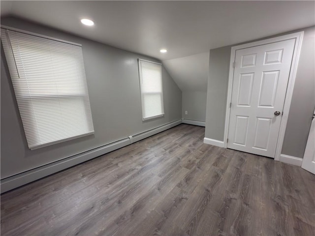 103 Pleasent St, Woonsocket, RI 02895 - additional living space with a baseboard radiator, vaulted ceiling, baseboards, wood finished floors, and recessed lighting