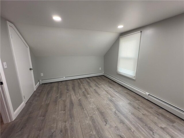 103 Pleasent St, Woonsocket, RI 02895 - bonus room with baseboard heating, vaulted ceiling, wood finished floors, recessed lighting, and baseboards