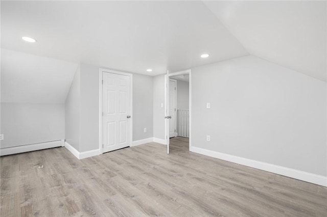 103 Pleasent St, Woonsocket, RI 02895 - additional living space featuring recessed lighting, lofted ceiling, wood finished floors, baseboards, and a baseboard heating unit